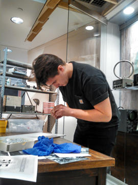Devin Kennedy at work in Special Exhibitions gallery.