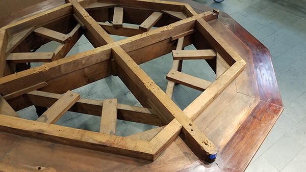 The wooden base of the orrery.